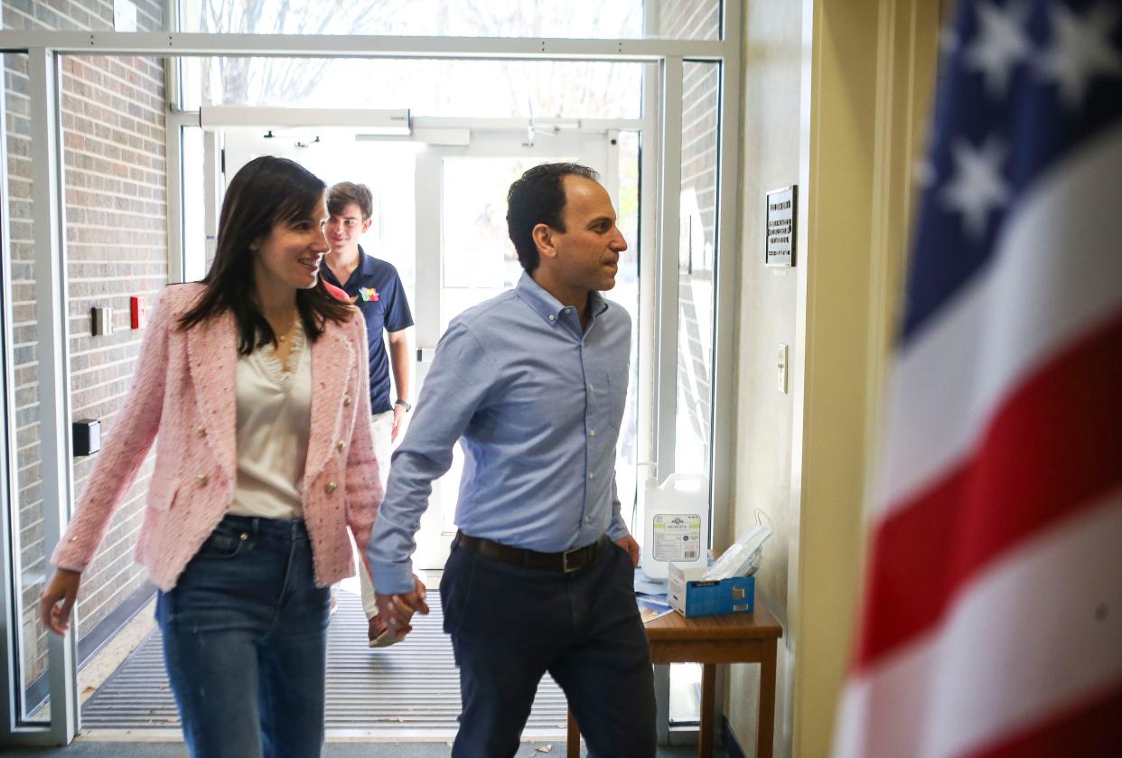 Then-Democratic candidate for mayor Craig Greenberg walks into the voting precinct with wife Rachel at the Louisville Presbyterian Theological Seminary on Nov. 8, 2022.