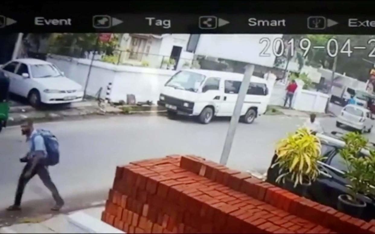 A suspected suicide bomber carries a backpack on a street in Negombo, Sri Lanka, in this still image taken from a CCTV handout footage of Easter Sunday attacks - REUTERS