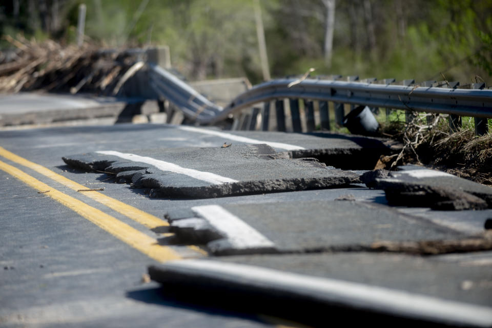 Damages on one of two North M-30 bridges on Wednesday, May 20, 2020 in Edenville Township north of Midland. After two days of heavy rain, the Edenville Dam failed and flood waters rushed south, ravaging the landscape in its path. (Jake May/The Flint Journal, MLive.com via AP)