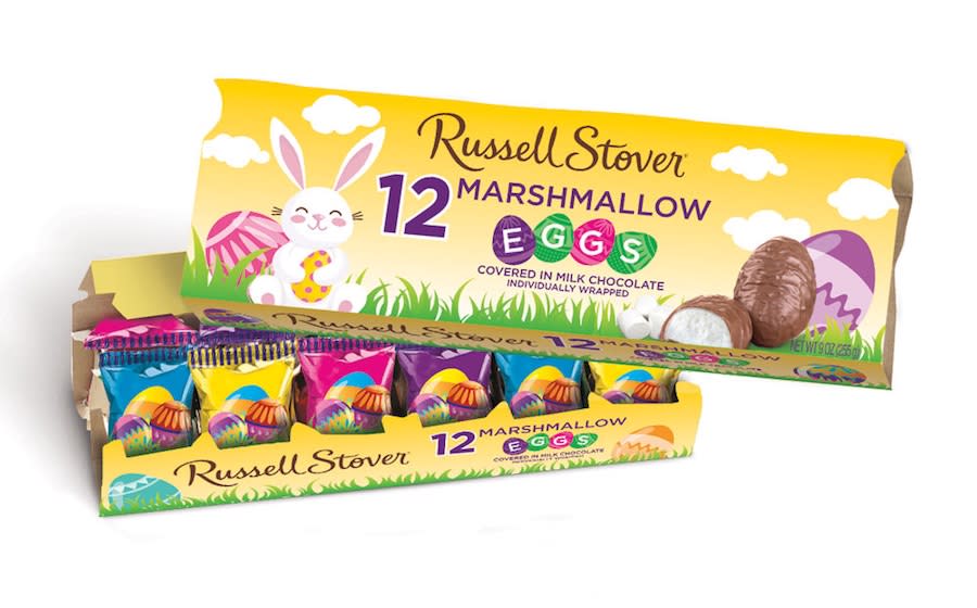 A collection of Russell Stover marshmallow eggs, both in a carton and loose eggs in a box
