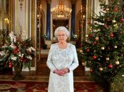 <p>For her 2012 Christmas message, Queen Elizabeth matched her jewelry the decorations, and sported a gold watch.</p>