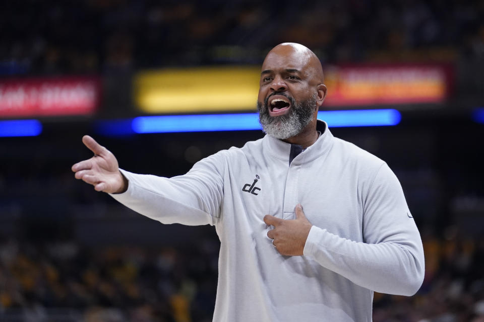 Washington Wizards coach Wes Unseld Jr. questions a call during the first half of the team's NBA basketball game against the Indiana Pacers, Wednesday, Oct. 19, 2022, in Indianapolis. (AP Photo/Michael Conroy)