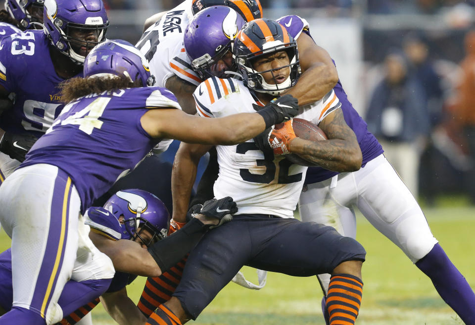 CHICAGO, ILLINOIS - SEPTEMBER 29:  David Montgomery #32 of the Chicago Bears is tackled by Anthony Barr #55 and Eric Kendricks #54 of the Minnesota Vikings during the second half at Soldier Field on September 29, 2019 in Chicago, Illinois. (Photo by Nuccio DiNuzzo/Getty Images)