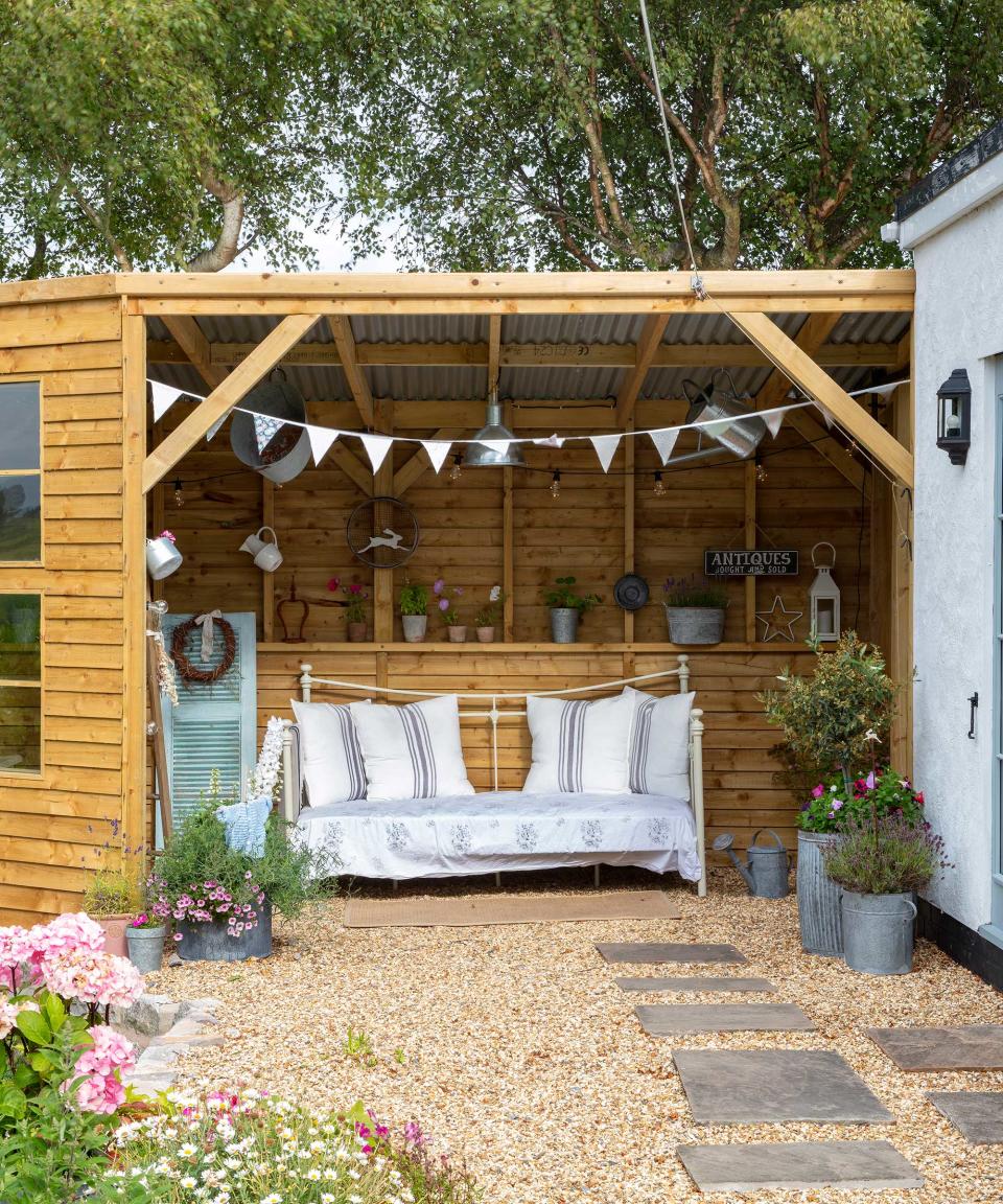 covered outside seating area decorated with vintage style pieces