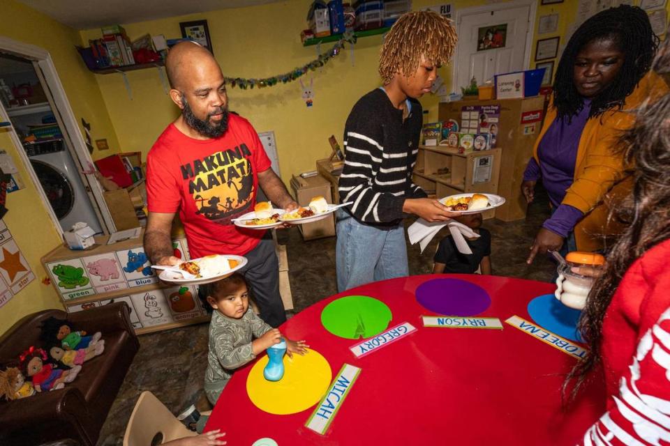 Michael and his daughter Halle Chaney serve dinner to the students in the evening at the Future Scholars’ Childcare and Transportation child care home in Grand Prairie on Thursday, March 14, 2024. Future Scholars’ is one of few programs in Tarrant County that provide 24/7 child care. Chris Torres/ctorres@star-telegram.com