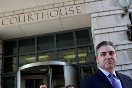 Cable News Network (CNN) Chief White House correspondent Jim Acosta departs after a judge temporarily restored Acosta's White House press credentials following a hearing at U.S. District Court in Washington, U.S., November 16, 2018. REUTERS/Carlos Barria