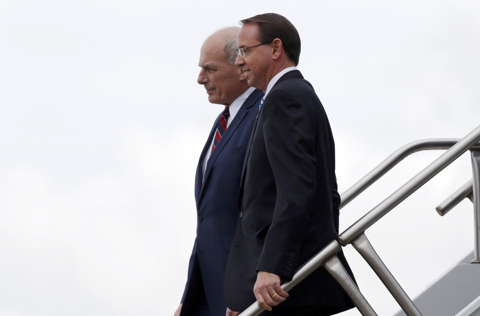 White House Chief of Staff John Kelly and Deputy Attorney General Rod Rosenstein step off Air Force One, Monday, Oct. 8, 2018, in Orlando, Fla. President Donald Trump said Monday he has no plans to fire Deputy Attorney General Rod Rosenstein, delivering a reprieve for the Justice Department official whose future has been the source of intense speculation for two weeks. (AP Photo/Alex Brandon)