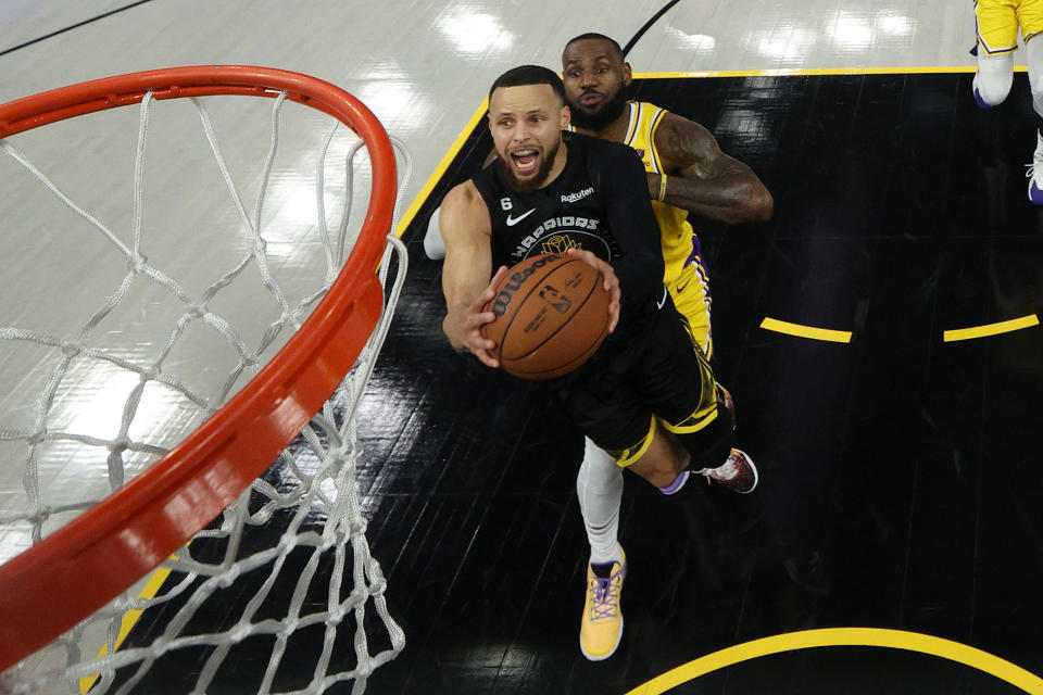 SAN FRANCISCO, CALIFORNIA - MAY 02: Stephen Curry #30 of the Golden State Warriors goes up for a shot on LeBron James #6 of the Los Angeles Lakers in game one of the Western Conference Semifinal Playoffs at Chase Center on May 02, 2023 in San Francisco, California. NOTE TO USER: User expressly acknowledges and agrees that, by downloading and or using this photograph, User is consenting to the terms and conditions of the Getty Images License Agreement. (Photo by Ezra Shaw/Getty Images)