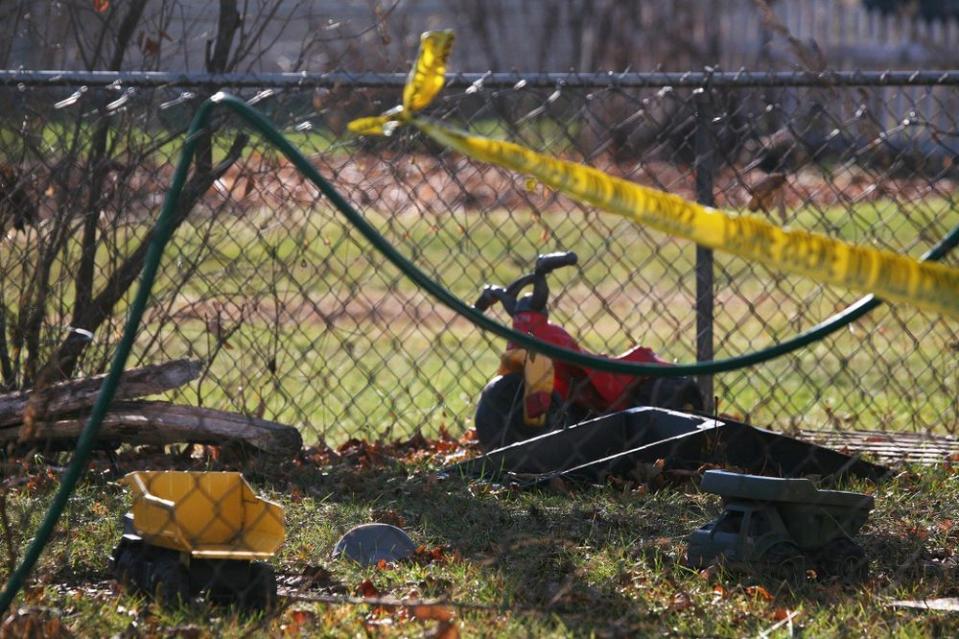 Crime scene tape surrounded the backyard of the home where the Skelton brothers were last seen in Morenci, Michigan, in 2010.