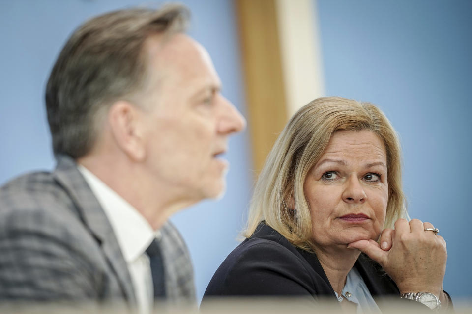 German Interior Minister Nancy Faeser, right, listens to Holger Münch, President of the Federal Criminal Police Office (BKA), during a press conference to announce the case figures for politically motivated crime, in Berlin, Tuesday, May 21, 2024. Politically motivated crime in Germany increased last year by almost 2%, taking it to the highest level since the government started recording these crimes more than 20 years ago, the country's top security official said Tuesday. (Kay Nietfeld/dpa via AP)