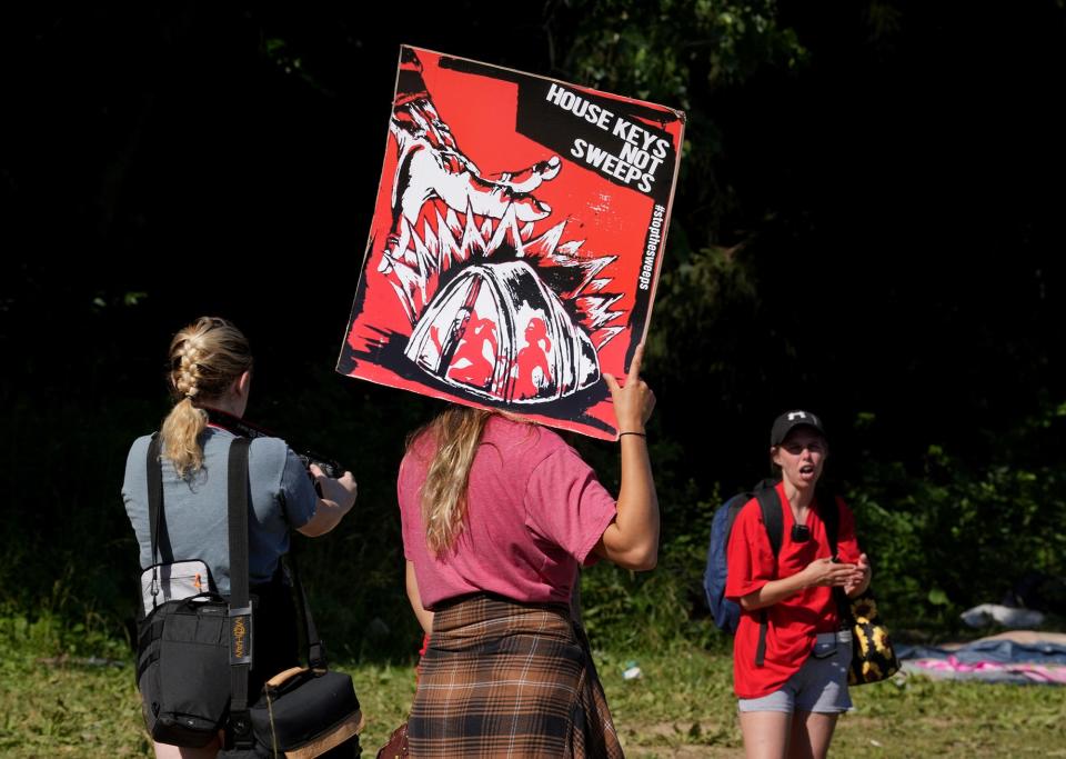 June 21, 2022; Columbus, Ohio; Homeless advocates protest  at the homeless camp adjacent to Heer Park as it is cleared up by the city on Tuesday, June 21, 2022. Fred Squillante- The Columbus Dispatch