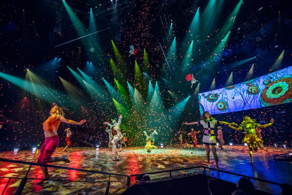 The cast of "The Beatles Love by Cirque du Soleil" perform the spirited finale of "All You Need Is Love" at the show, which plays at The Mirage casino in Las Vegas.