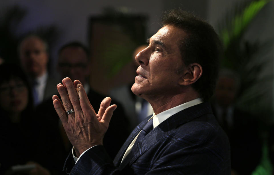 FILE - In this March 15, 2016 file photo, casino mogul Steve Wynn gestures during a news conference in Medford, Mass. A former beauty salon director from Las Vegas who went public about sexual misconduct allegations against casino mogul Steve Wynn is suing Wynn Resorts and executives, alleging they invaded his privacy and spied on him at his next job in a bid to undercut his accounts. (AP Photo/Charles Krupa, File)