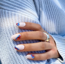 <p>Nothing says Fourth of July like foil in red and blue. Paint your nails an off-white color and add some white glitter to make them patriotic.</p><p><a href="https://www.amazon.com/Makartt-Transfer-Stickers-Adhesive-Decoration/dp/B00UYNHHKY/ref=sr_1_10?crid=12VHP6GR44B3I&keywords=nail%2Bfoil&qid=1653306154&s=beauty&sprefix=nail%2Bfoil%2Cbeauty%2C113&sr=1-10&th=1&tag=syn-yahoo-20&ascsubtag=%5Bartid%7C10055.g.1278%5Bsrc%7Cyahoo-us" rel="nofollow noopener" target="_blank" data-ylk="slk:SHOP NAIL FOIL;elm:context_link;itc:0;sec:content-canvas" class="link ">SHOP NAIL FOIL</a> </p>