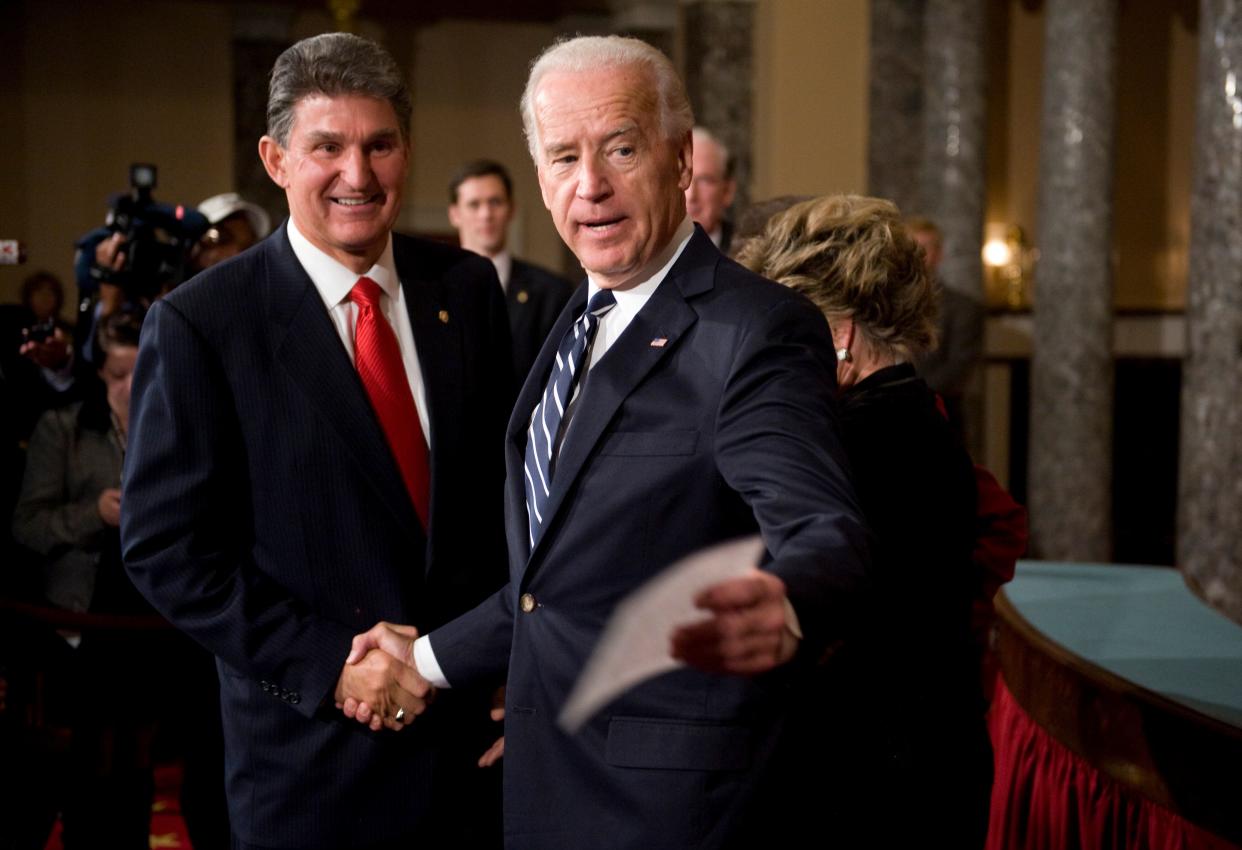 President Joe Biden needs the support of Sen. Joe Manchin (D-W.Va.) (left) to pass any COVID-19 relief bill. WorkMoney is hoping to mobilize voters in key states including West Virginia. (Photo: Tom Williams/Getty Images)