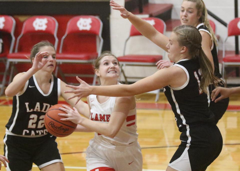 Mansfield Christian's Alexis Ripple finished a layup in traffic during the Flames' 52-42 win over New London on Friday night in the 2022-23 season opener.