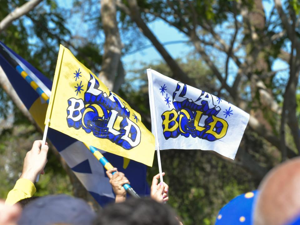 Signs at the Los Angeles Rams Super Bowl LVI Victory Parade and Rally on February 16, 2022 in Los Angeles, California