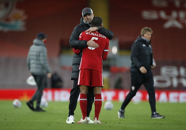 Liverpool manager Jurgen Klopp hugs Georginio Wijnaldum 