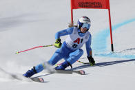 Italy's Marta Bassino speeds down the course during an alpine ski, women's World Championships super G, in Meribel, France, Wednesday, Feb. 8, 2023. (AP Photo/Alessandro Trovati)