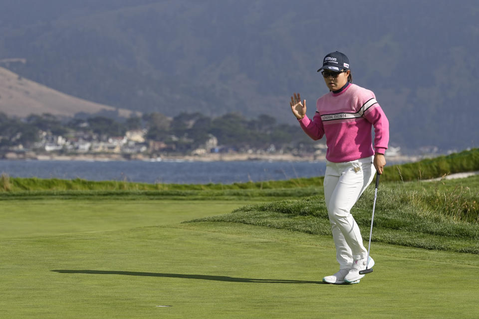 Nasa Hataoka, of Japan, waves to the gallery after making a birdie putt on the 17th green during the third round of the U.S. Women's Open golf tournament at the Pebble Beach Golf Links, Saturday, July 8, 2023, in Pebble Beach, Calif. (AP Photo/Darron Cummings)