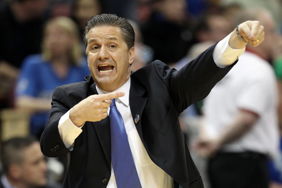 LOUISVILLE, KY - MARCH 17: Head coach John Calipari of the Kentucky Wildcats coaches in the first half against the Iowa State Cyclones during the third round of the 2012 NCAA Men's Basketball Tournament at KFC YUM! Center on March 15, 2012 in Louisville, Kentucky. (Photo by Andy Lyons/Getty Images)