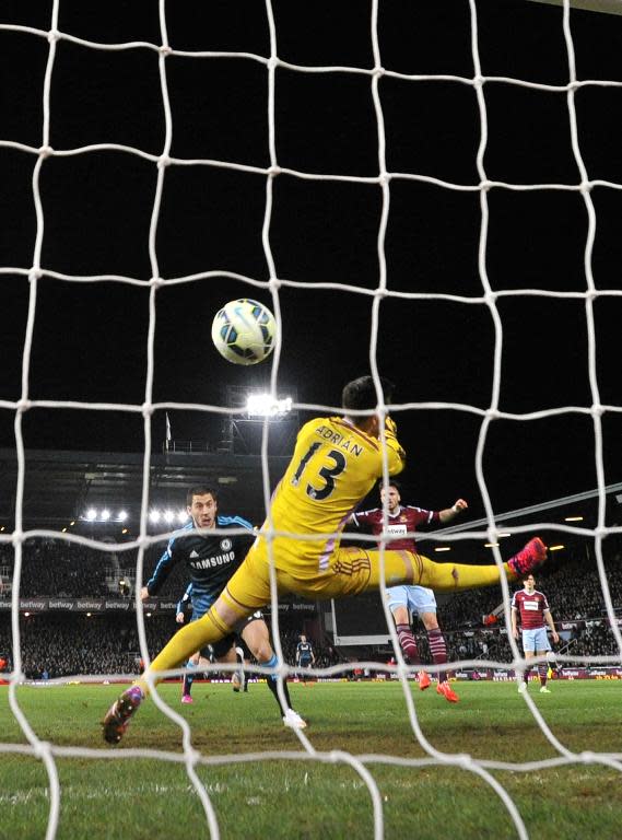 Chelsea's Belgian midfielder Eden Hazard (L) scores the only goal in his side's win against West Ham at Upton Park on March 4, 2015