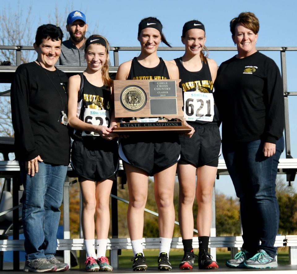 The Dakota Hills cross country team captured the state Class B girls championship in the 2019 South Dakota State Cross Country meet at Huron — the first state title in the co-op’s history. Team members include, from left, head coach Susan Zirbel, Madison Zirbel, Victoria Zirbel, Eva Banike and assistant coach Vicki Benike.