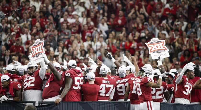 Oklahoma celebrates a 30-23 overtime win against Baylor in the Big 12 Championship game Saturday, Dec. 7, 2019, in Arlington, Texas. (AP Photo/Brandon Wade)