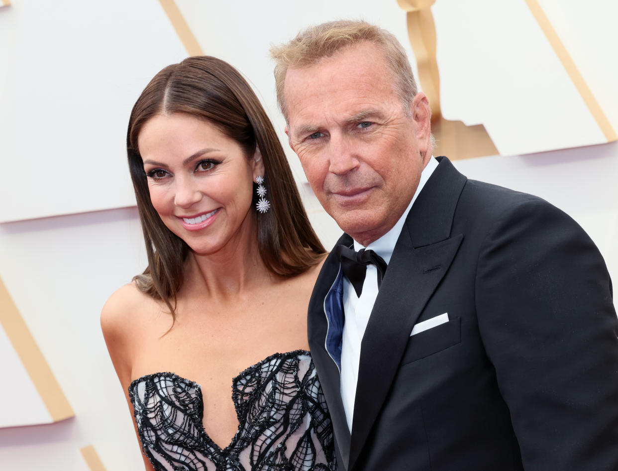 Kevin Costner and wife Christine Baumgartner attend the 2022 Oscars in Hollywood, California.