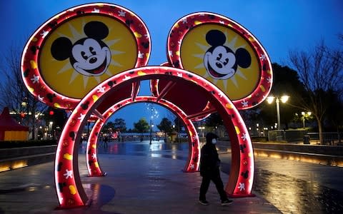 Beijing has closed many tourist attractions, such as Disneyland in Shanghai - Credit: Aly Song/Reuters