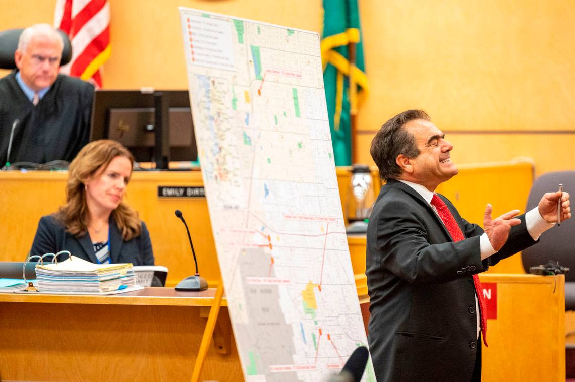 Peter Mazzone, the defense attorney for Dorcus Allen, presents his opening statement as Pierce County Superior Court Judge Edmund Murphy looks on during a retrial on Monday, Oct. 3, 2022, in Tacoma. This is the second trial for Allen, who is accused of being the getaway driver in a 2009 shooting at a Parkland coffee shop where four Lakewood police officers were killed. In 2015 the Washington State Supreme Court ruled that Allen did not receive a fair trial.