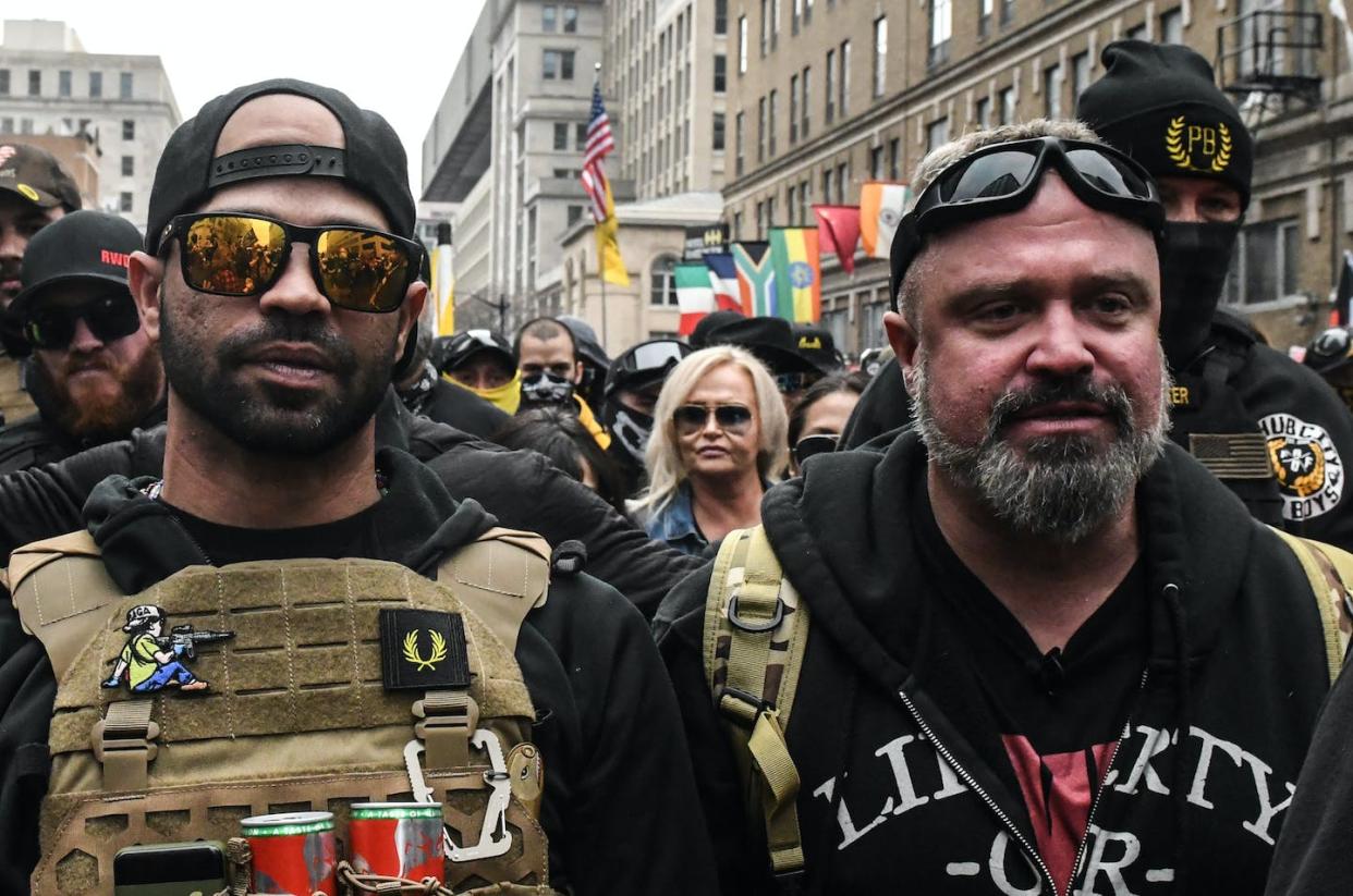 Enrique Tarrio, leader of the Proud Boys, at left, and group member Joe Biggs were sentenced to many years in federal prison. <a href="https://www.gettyimages.com/detail/news-photo/enrique-tarrio-leader-of-the-proud-boys-and-joe-biggs-news-photo/1230086703" rel="nofollow noopener" target="_blank" data-ylk="slk:Stephanie Keith/Getty Images;elm:context_link;itc:0;sec:content-canvas" class="link ">Stephanie Keith/Getty Images</a>