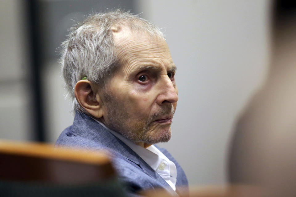 FILE - In this March 10, 2020, file photo, real estate heir Robert Durst looks over during his murder trial in Los Angeles. Fourteen months after the murder trial of New York real estate heir Durst was put on hold because of the coronavirus pandemic, jurors are returning to court to see if they can finish the assignment they were given. A Los Angeles judge will question jurors Monday, May 17, 2021, to find out if they can continue to serve in the case that is expected to last four to five months. (AP Photo/Alex Gallardo, Pool, File)