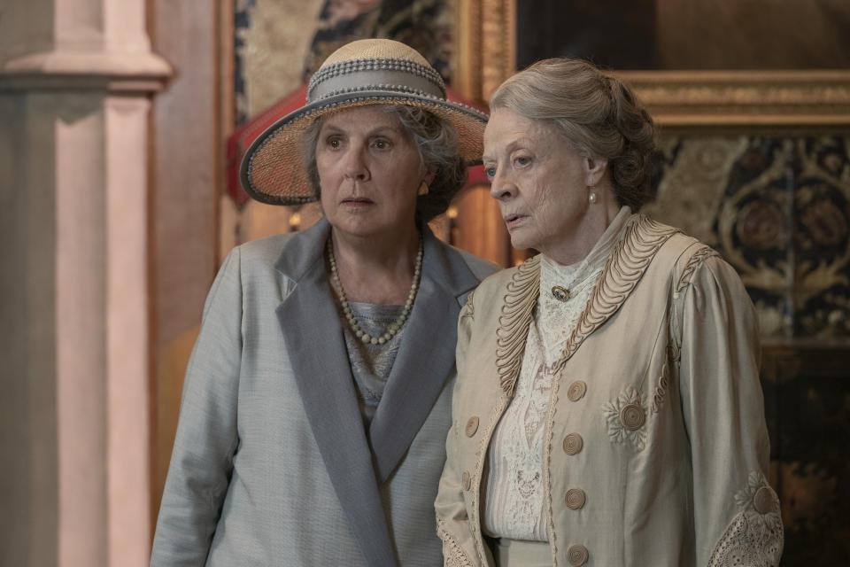 This image released by Focus Features shows Penelope Wilton as Isobel Merton, left, and Maggie Smith as Violet Grantham in a scene from "Downton Abbey: A New Era." (Ben Blackall/Focus Features via AP)