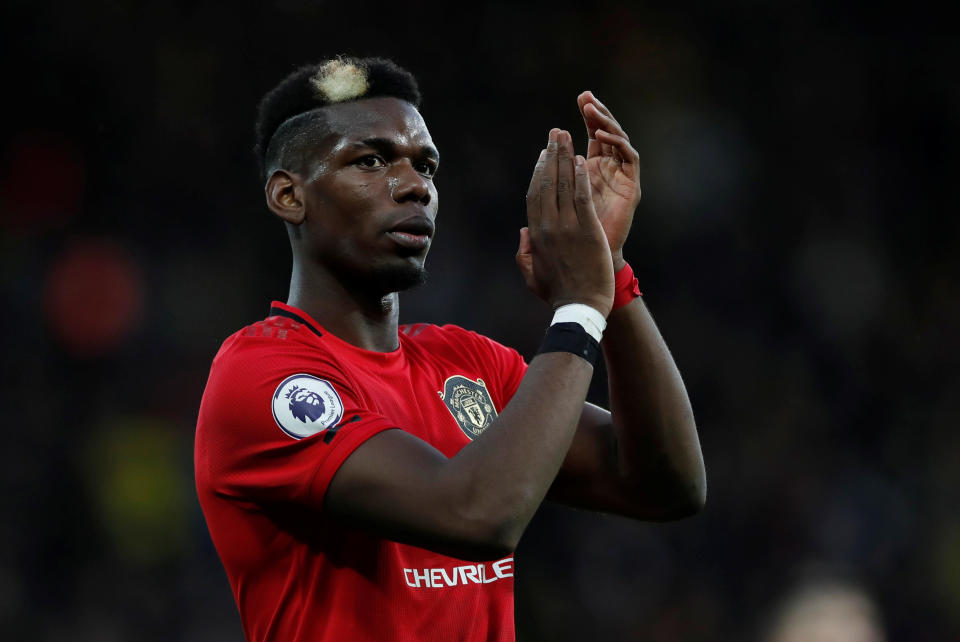 Soccer Football - Premier League - Watford v Manchester United - Vicarage Road, Watford, Britain - December 22, 2019  Manchester United's Paul Pogba applauds fans after the match   Action Images via Reuters/Paul Childs  EDITORIAL USE ONLY. No use with unauthorized audio, video, data, fixture lists, club/league logos or "live" services. Online in-match use limited to 75 images, no video emulation. No use in betting, games or single club/league/player publications.  Please contact your account representative for further details.