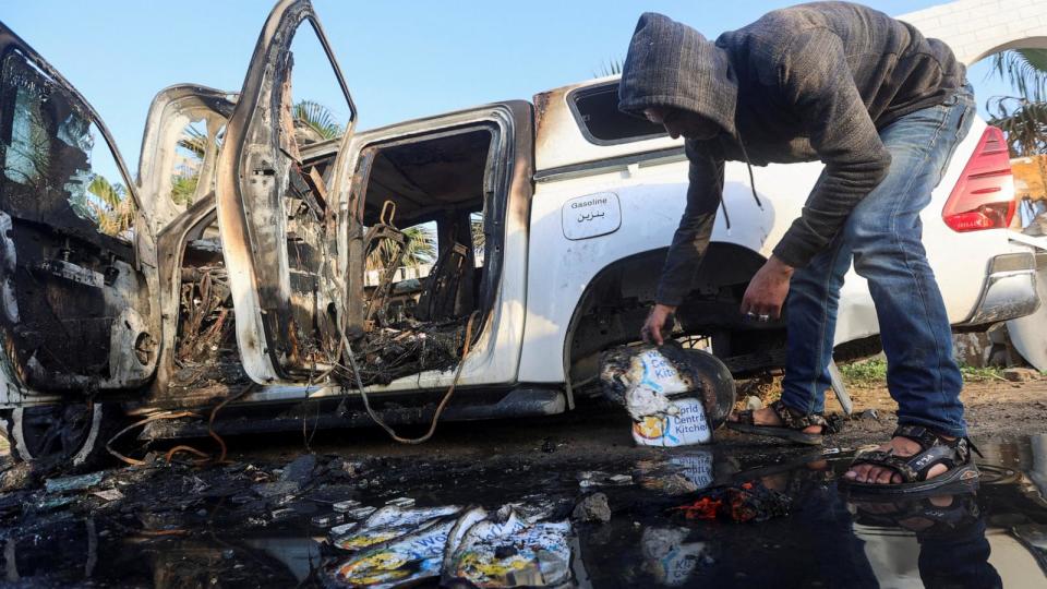 PHOTO: A Palestinian inspects a vehicle where employees from the World Central Kitchen were killed in an Israeli airstrike, in Deir Al-Balah, in the central Gaza, Strip Apr. 2, 2024.  (Ahmed Zakot/Reuters)