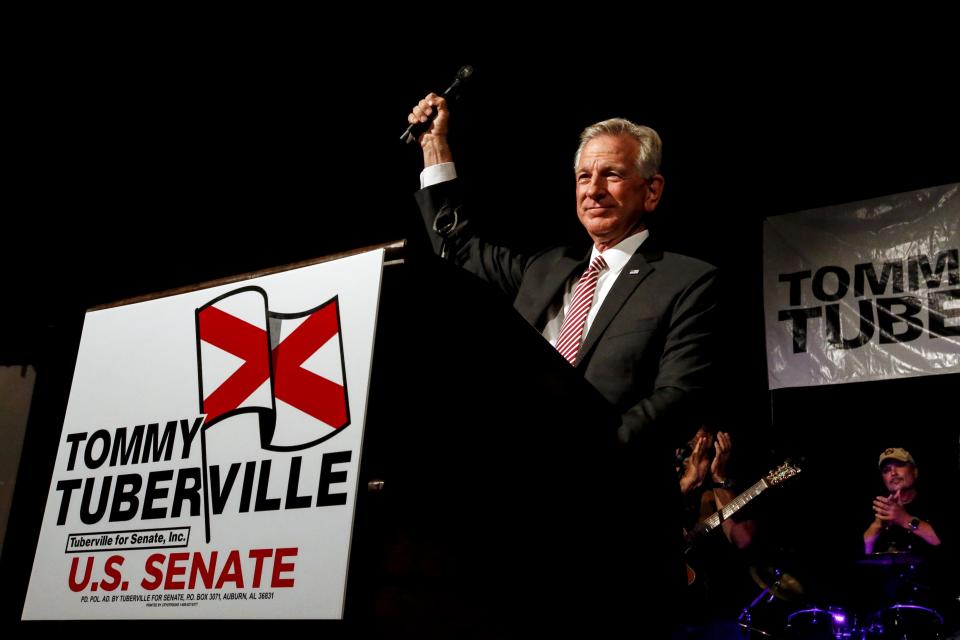 FILE- In this Tuesday, July 14, 2020, file photo, former Auburn coach, Tommy Tuberville, speaks to supporters after he defeated Senator Jeff Sessions in the runoff election in Montgomery, Ala. U.S. Sen. Doug Jones is outspending Tuberville in the home stretch of Alabama’s Senate race.   (AP Photo/Butch Dill, File)