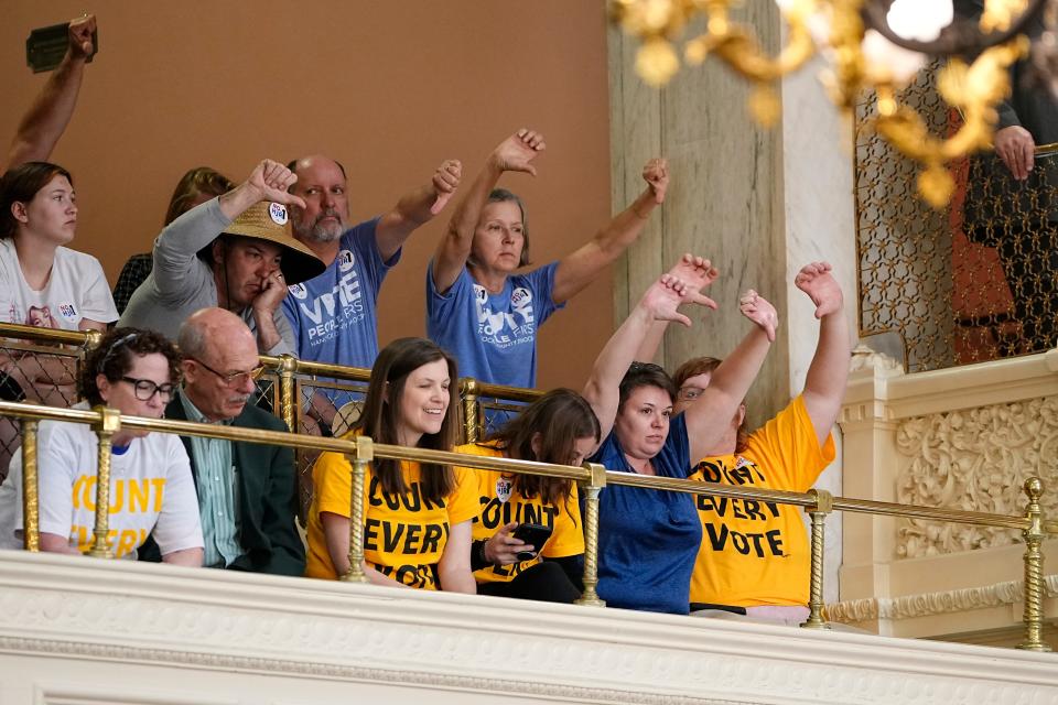 Protesters put their thumbs down as representatives debate on the floor of the Ohio House inside the Ohio Statehouse on whether to create an August special election for a resolution that would increase the voter threshold to 60 percent for constitutional amendments. The gallery was cleared shortly after. Mandatory Credit: Adam Cairns-The Columbus Dispatch