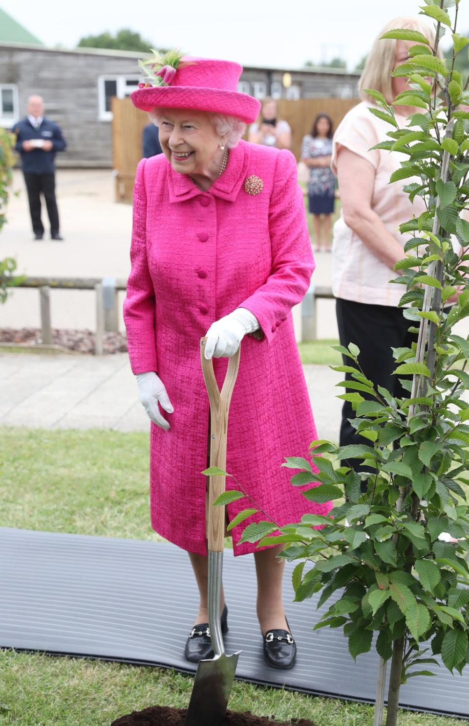 The Queen planted a tree during a visit to the National Institute of Agricultural Botany Park Farm in Cambridge (PA) (PA Archive)