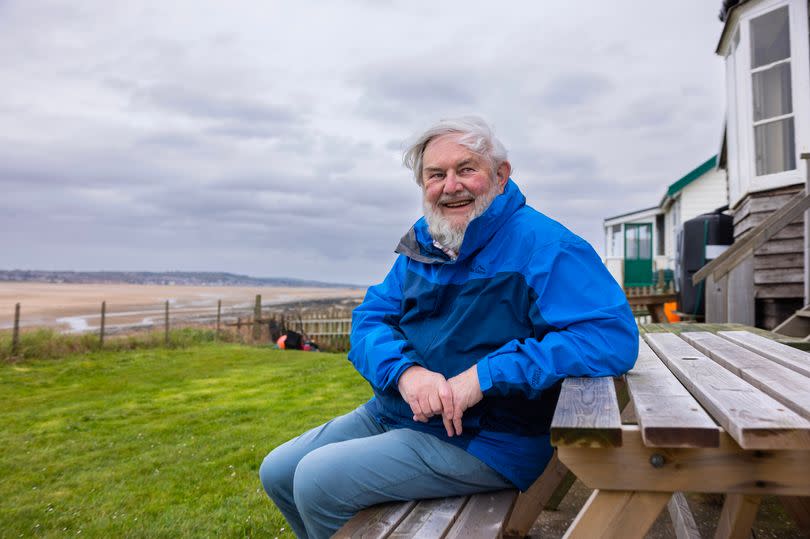 Mike Cox outside his holiday home on Hilbre Island
