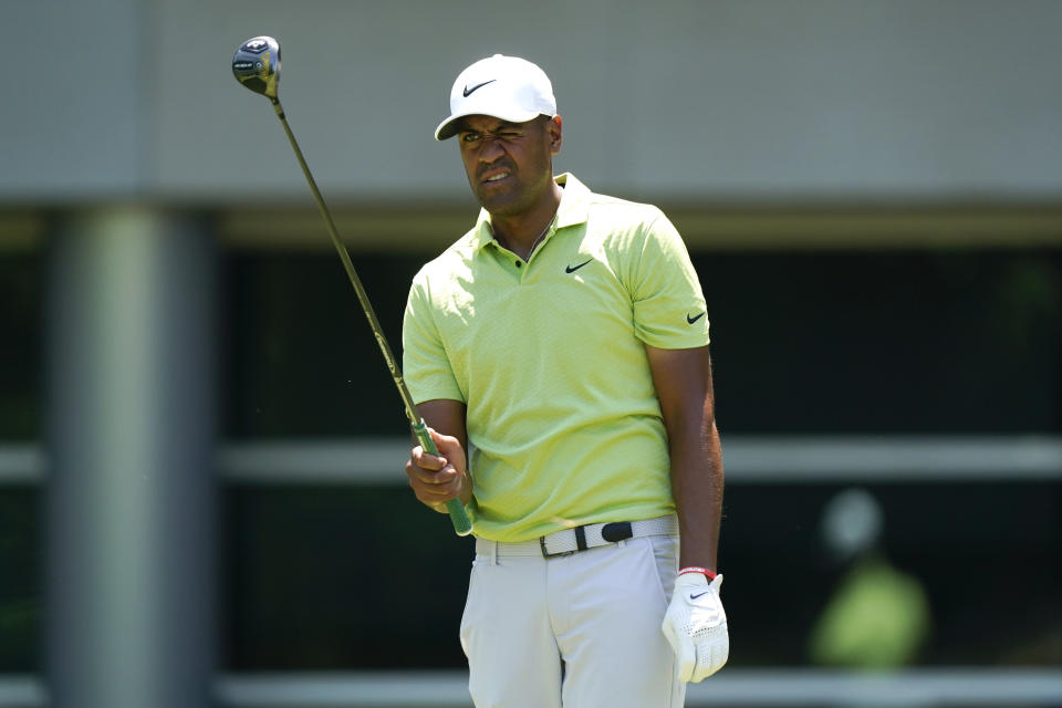 Tony Finau lines up his shot before hitting off the sixth tee during the final round of the St. Jude Championship golf tournament, Sunday, Aug. 14, 2022, in Memphis, Tenn. (AP Photo/Mark Humphrey)