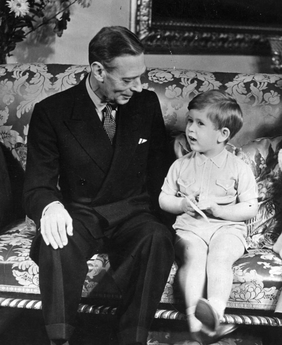 November 1951:  King George VI (1895 - 1952) with Prince Charles on his third birthday.  (Photo by Topical Press Agency/Getty Images)