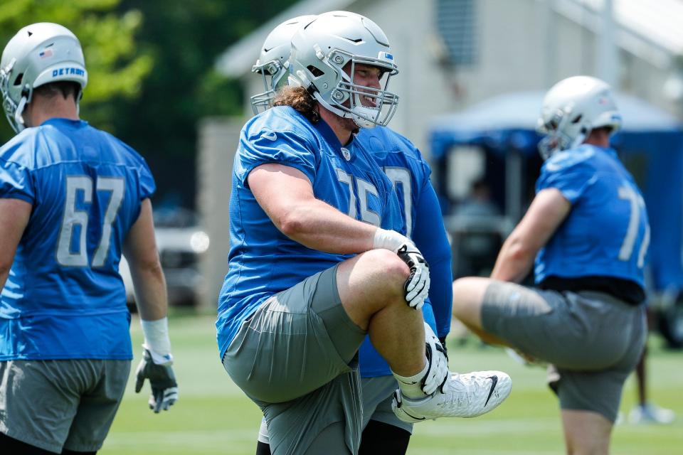Lions offensive lineman Colby Sorsdal warms up minicamp at in Allen Park on Wednesday, June 7, 2023.