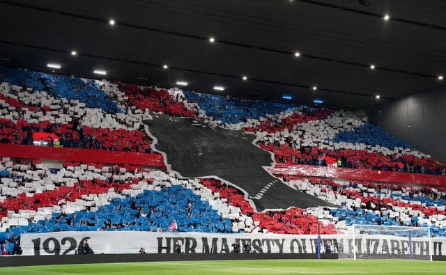 Rangers fans pay tribute to the Queen before the match against Napoli at Ibrox