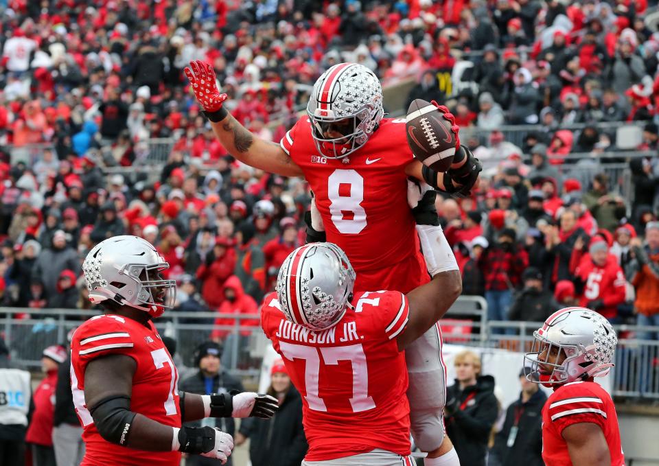 Ohio State tight end Cade Stover (8) and offensive lineman Paris Johnson Jr. (77) celebrate a touchdown  against Indiana at Ohio Stadium.
