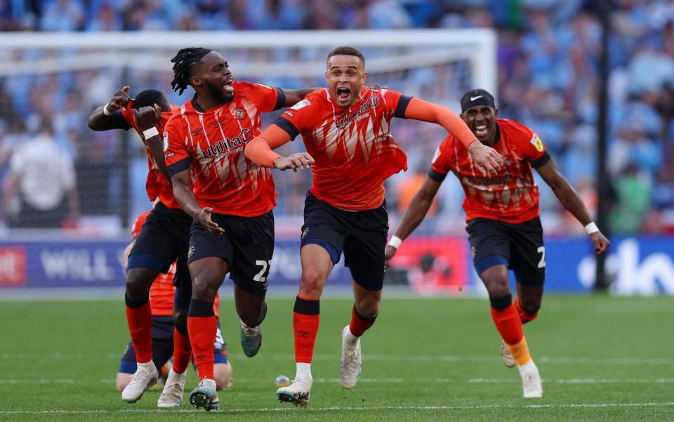 Players of Luton Town celebrate after Fankaty Dabo of Coventry City - Getty Images/Richard Heathcote