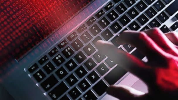 hand on computer screen.  (STOCK PHOTO/Getty Images)