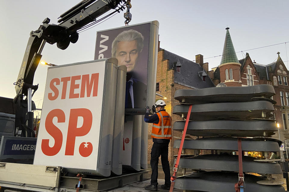 An eclection campaing poster of Geert Wilders' PVV party is removed in The Hague, the Netherlands, Thursday, Nov. 23, 2023. The far-right and anti-Islam populist Geert Wilders is heading for a massive parliamentary election victory. It's one of the biggest political upsets in Dutch politics since World War II and one that is bound to send shockwaves through Europe. (AP Photo/Aleksandar Furtula)