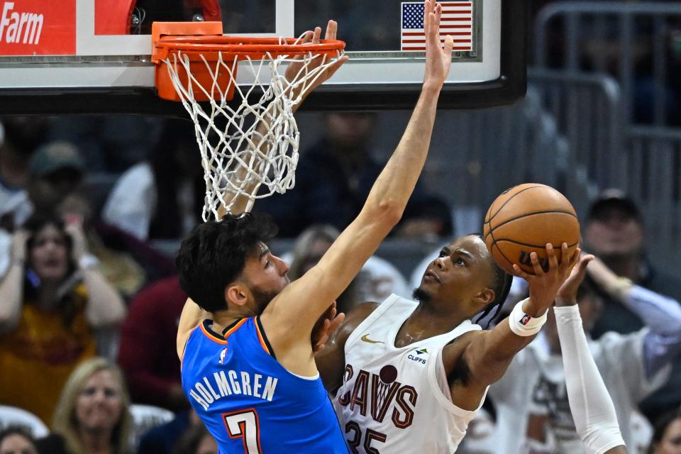 Oct 27, 2023; Cleveland, Ohio, USA; Cleveland Cavaliers forward Isaac Okoro (35) moves against Oklahoma City Thunder forward Chet Holmgren (7) in the second quarter at Rocket Mortgage FieldHouse. Mandatory Credit: David Richard-USA TODAY Sports