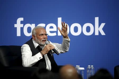 Indian Prime Minister Narendra Modi speaks on stage during a town hall at Facebook's headquarters in Menlo Park, California September 27, 2015. REUTERS/Stephen Lam